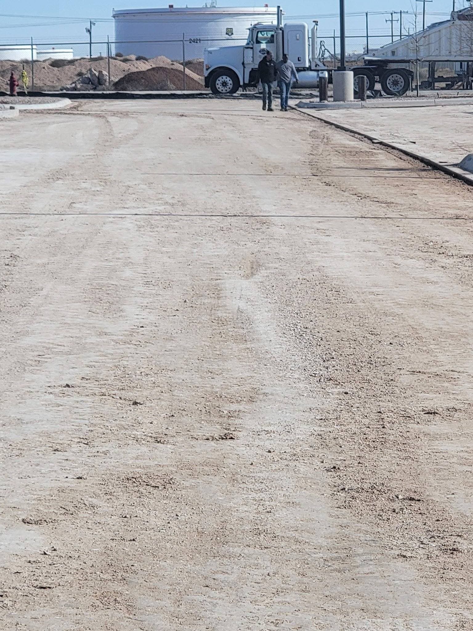 Wide view of graded well pad site