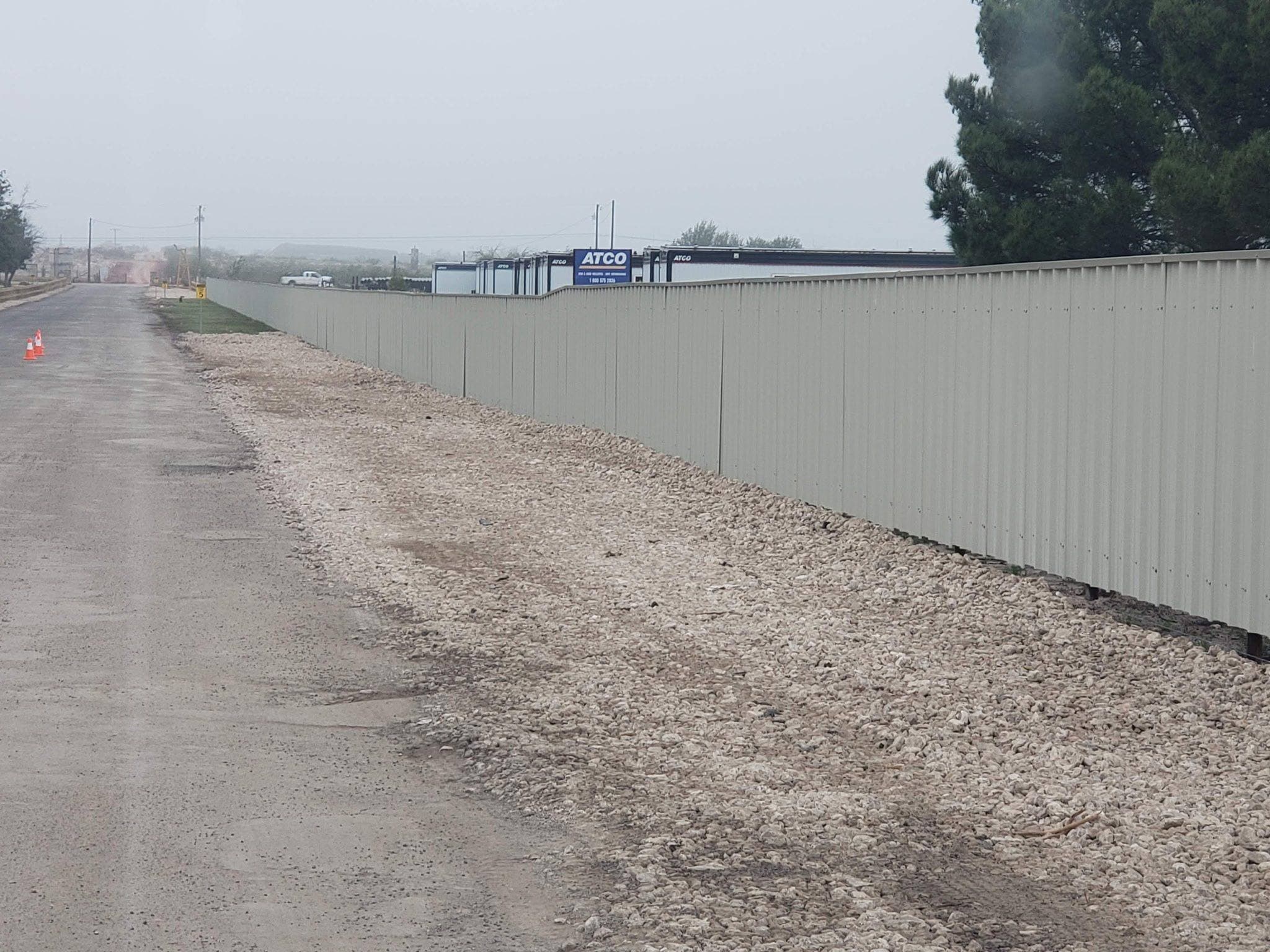 Graded shoulder beside a commercial metal building